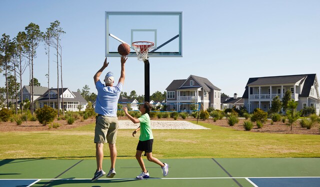 view of sport court with a yard, community basketball court, a residential view, and volleyball court