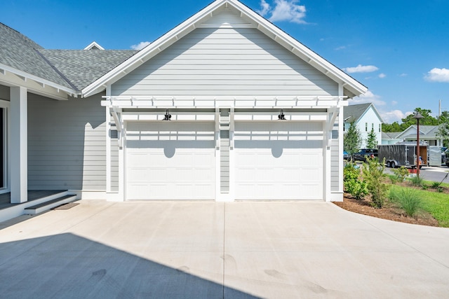 garage with concrete driveway