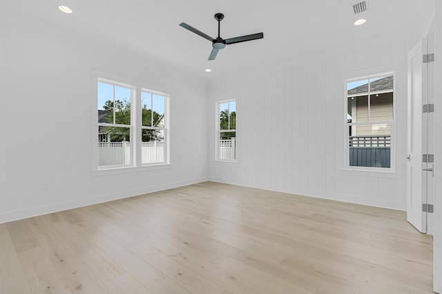 unfurnished room with recessed lighting, visible vents, ceiling fan, light wood-type flooring, and baseboards