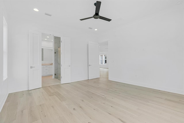 unfurnished bedroom featuring recessed lighting, light wood-style flooring, ornamental molding, connected bathroom, and baseboards