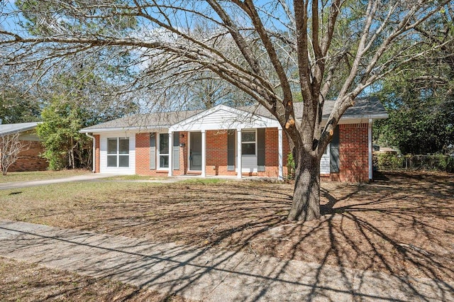 ranch-style house with brick siding