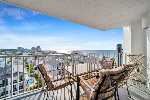 balcony featuring a water view