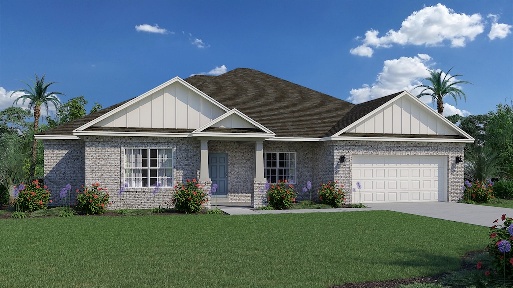 view of front of property featuring a garage and a front yard