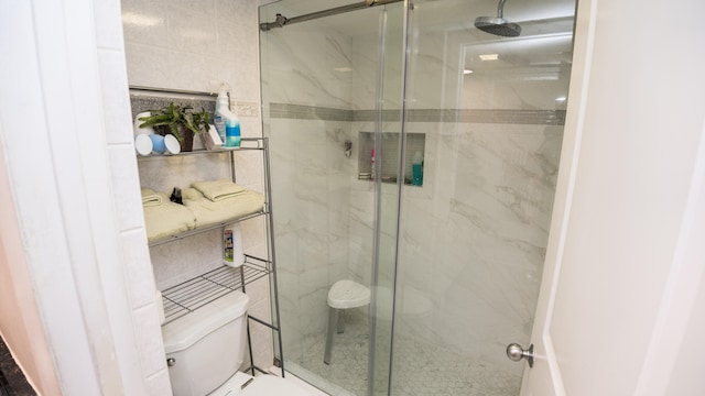 bathroom with walk in shower and toilet