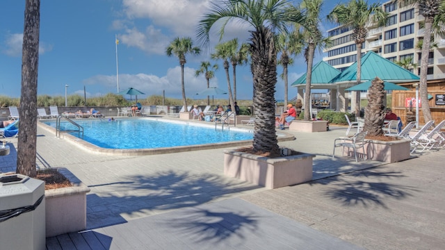 view of swimming pool featuring a patio area