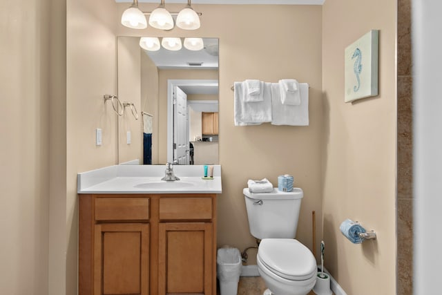 bathroom featuring tile floors, toilet, and oversized vanity