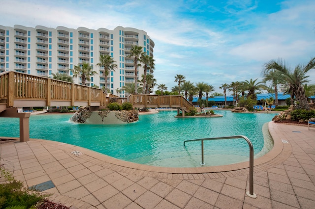 view of swimming pool featuring pool water feature