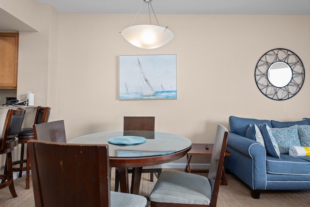 dining room with light wood-type flooring