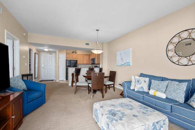 living room with light colored carpet