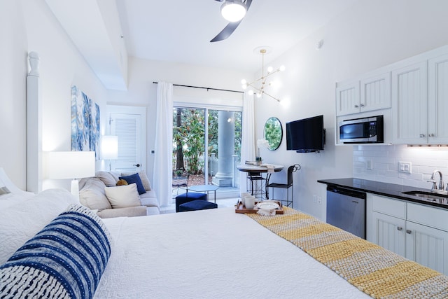 bedroom featuring a chandelier, sink, and access to exterior