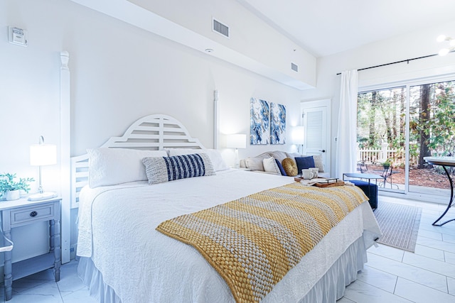 tiled bedroom featuring access to exterior