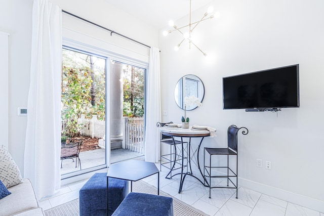 dining space featuring an inviting chandelier and light tile floors