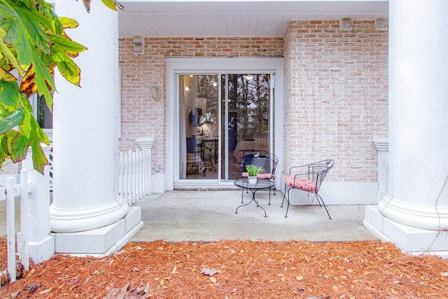 doorway to property featuring a patio area