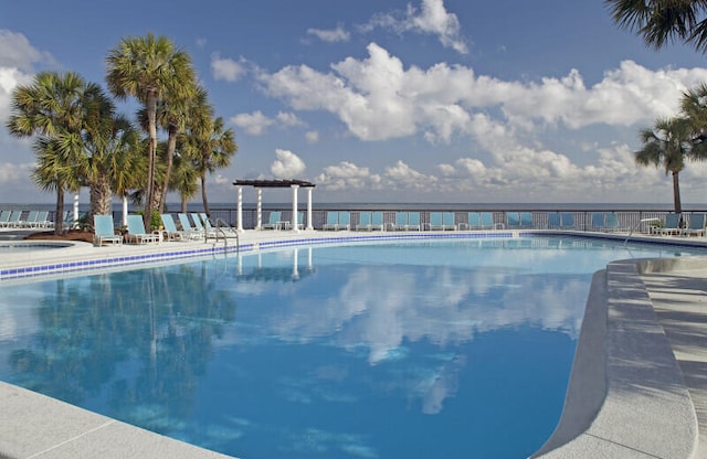 view of swimming pool featuring a pergola