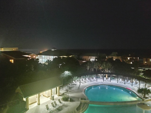 view of pool at night