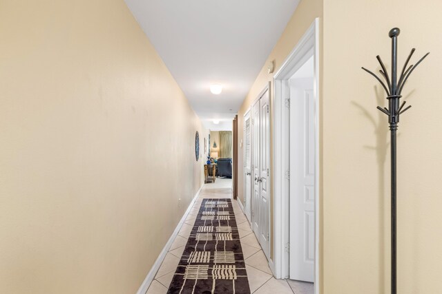 hallway featuring tile patterned flooring