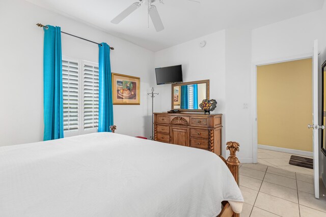 bedroom featuring light tile patterned flooring, multiple windows, and ceiling fan