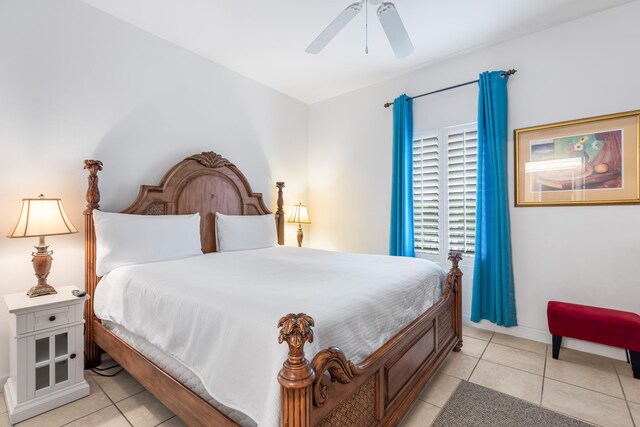 tiled bedroom with ceiling fan