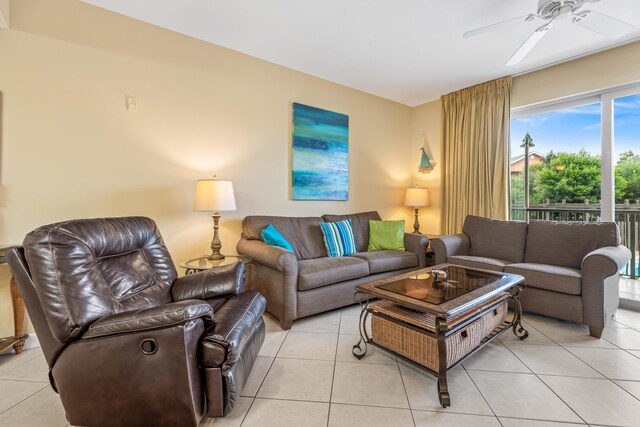 tiled living room with ceiling fan