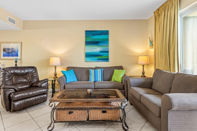 living room with a healthy amount of sunlight and light tile patterned floors