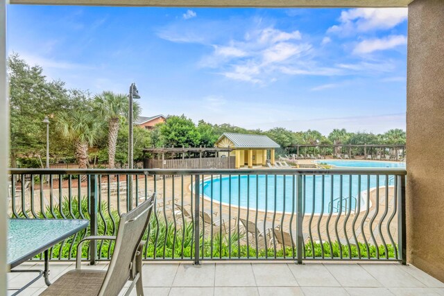 view of pool with a patio and an outdoor structure