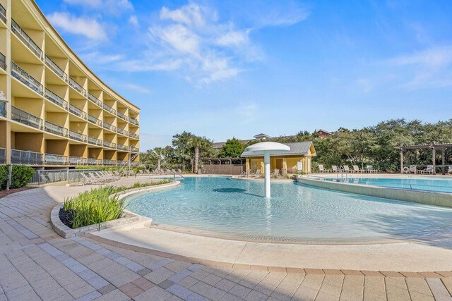 view of swimming pool featuring a pergola