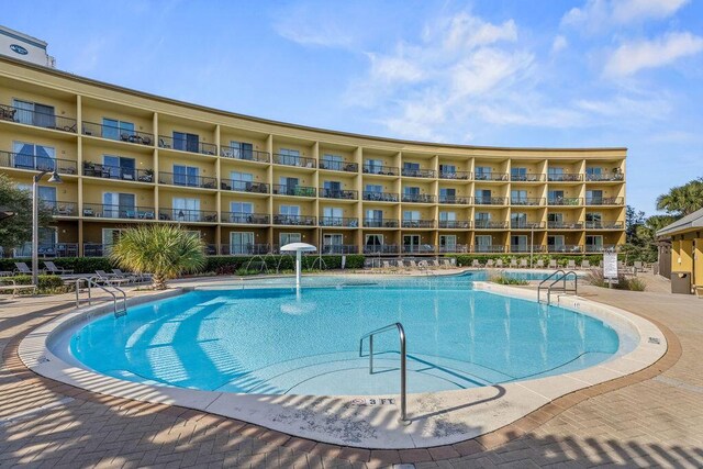 view of pool featuring pool water feature