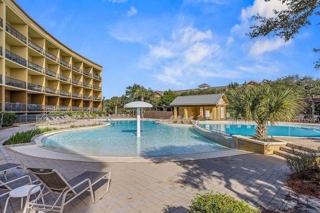 view of pool featuring a patio area