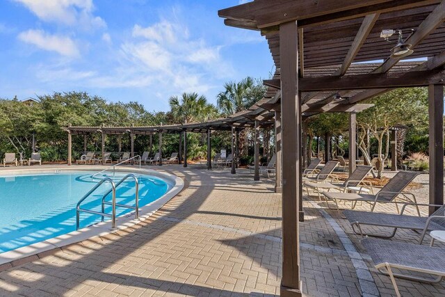 view of pool featuring a pergola and a patio