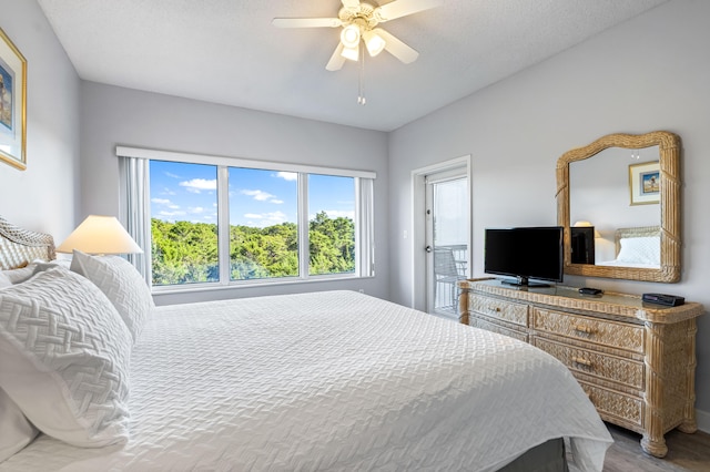 bedroom with wood-type flooring and ceiling fan