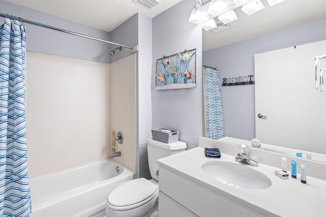 full bathroom featuring vanity with extensive cabinet space, shower / bath combo, toilet, and a textured ceiling