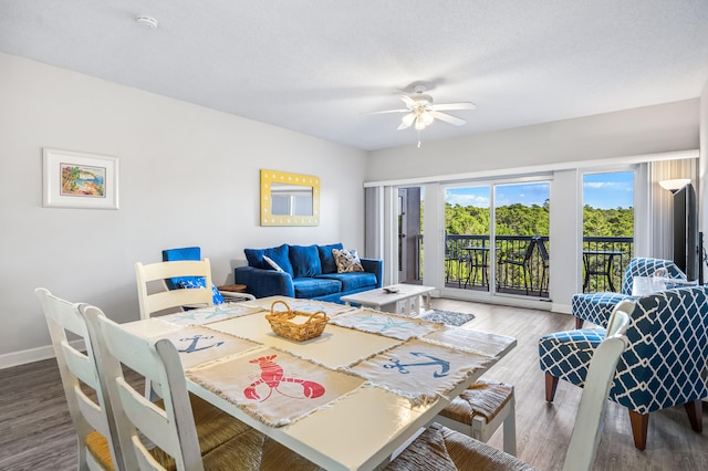 dining room featuring hardwood / wood-style floors and ceiling fan