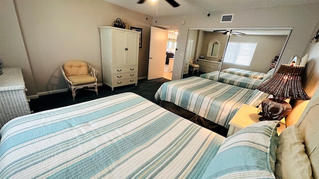 bedroom featuring ceiling fan and dark colored carpet