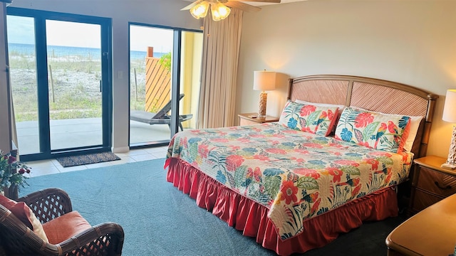 bedroom featuring light colored carpet, ceiling fan, and access to outside