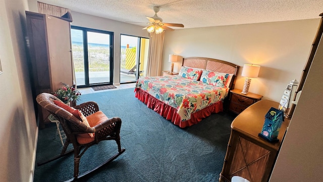 bedroom featuring ceiling fan, a textured ceiling, dark carpet, and access to exterior