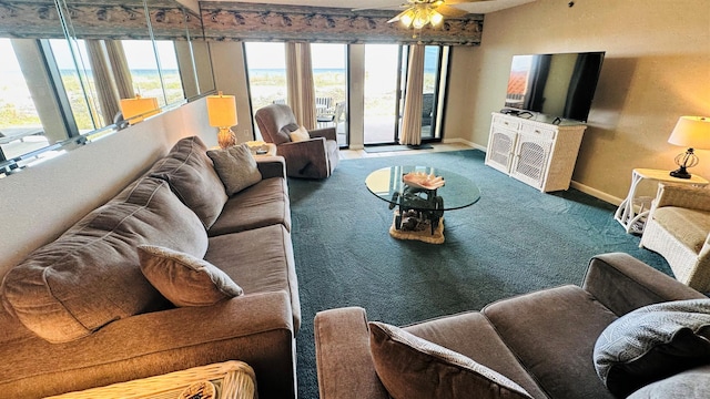 carpeted living room with ceiling fan