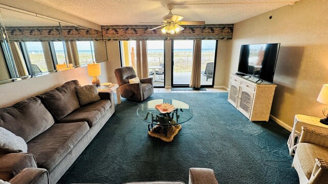 living room with dark colored carpet, vaulted ceiling, ceiling fan, and a textured ceiling