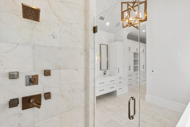 bathroom featuring a shower with door, tile flooring, vanity, and a notable chandelier