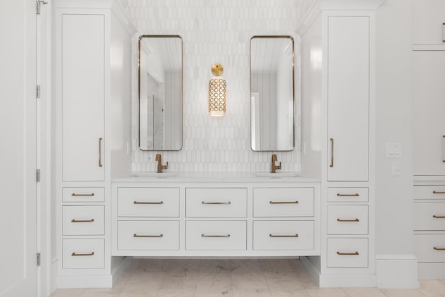 bathroom featuring tasteful backsplash, double vanity, and tile flooring