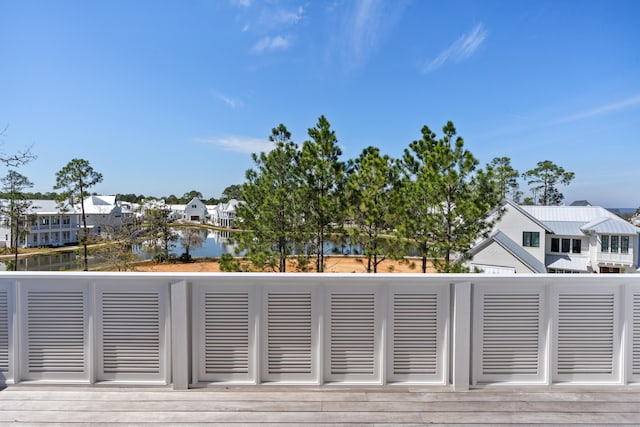 wooden deck with a water view