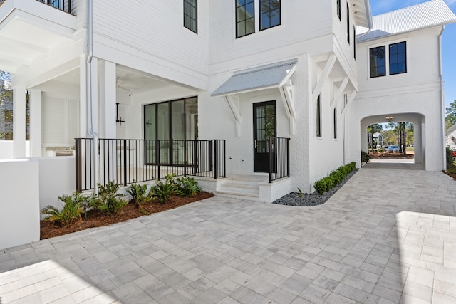 view of exterior entry featuring a porch