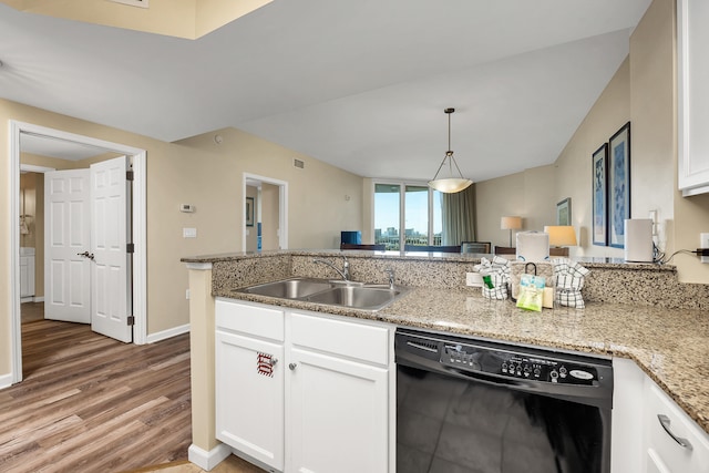 kitchen with white cabinets, sink, black dishwasher, and light wood-type flooring