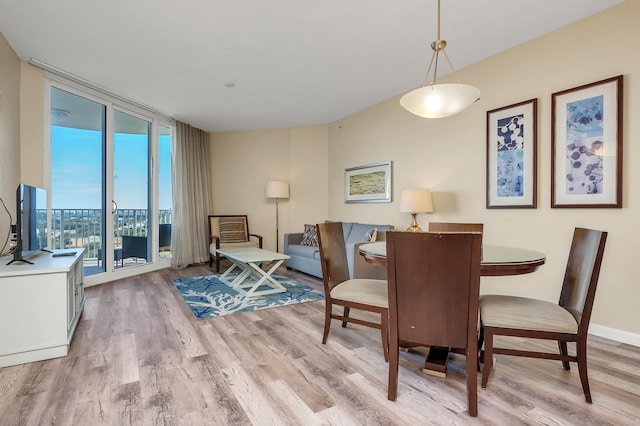 dining space featuring light hardwood / wood-style flooring