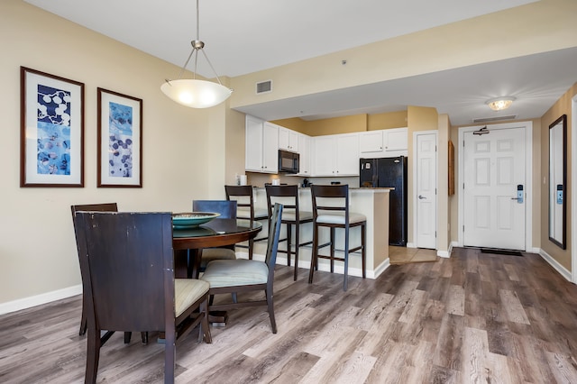 dining room featuring hardwood / wood-style flooring