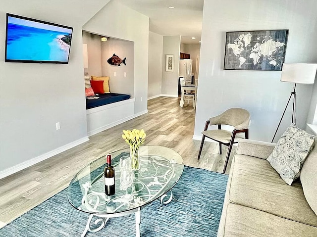 living room with light hardwood / wood-style flooring