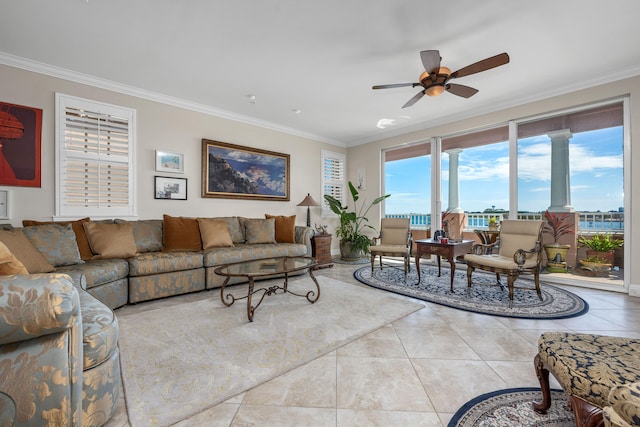 tiled living room with ceiling fan and ornamental molding