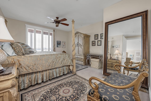 bedroom with ceiling fan and light carpet