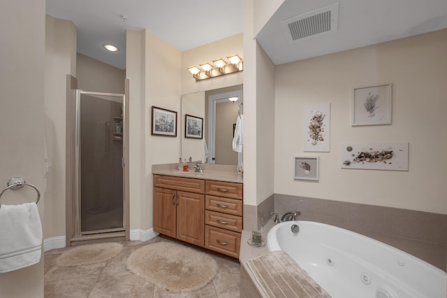 bathroom featuring separate shower and tub, tile flooring, and vanity