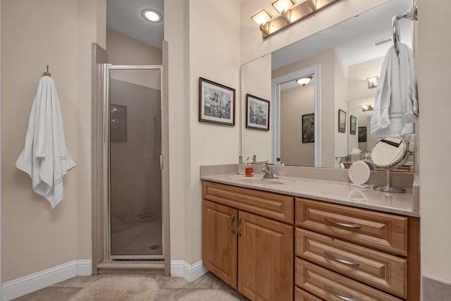 bathroom with a shower with door, tile flooring, and vanity