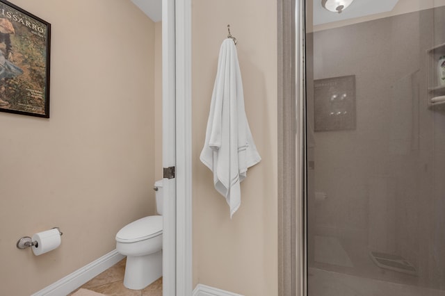 bathroom featuring walk in shower, toilet, and tile flooring